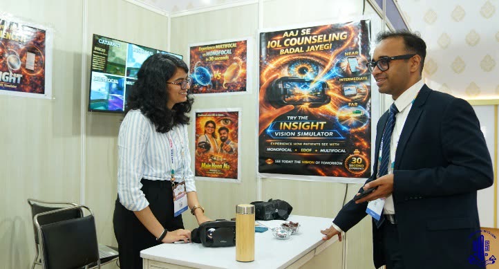 AKSightXR team member in conversation with a visiting doctor at the InSight demo counter